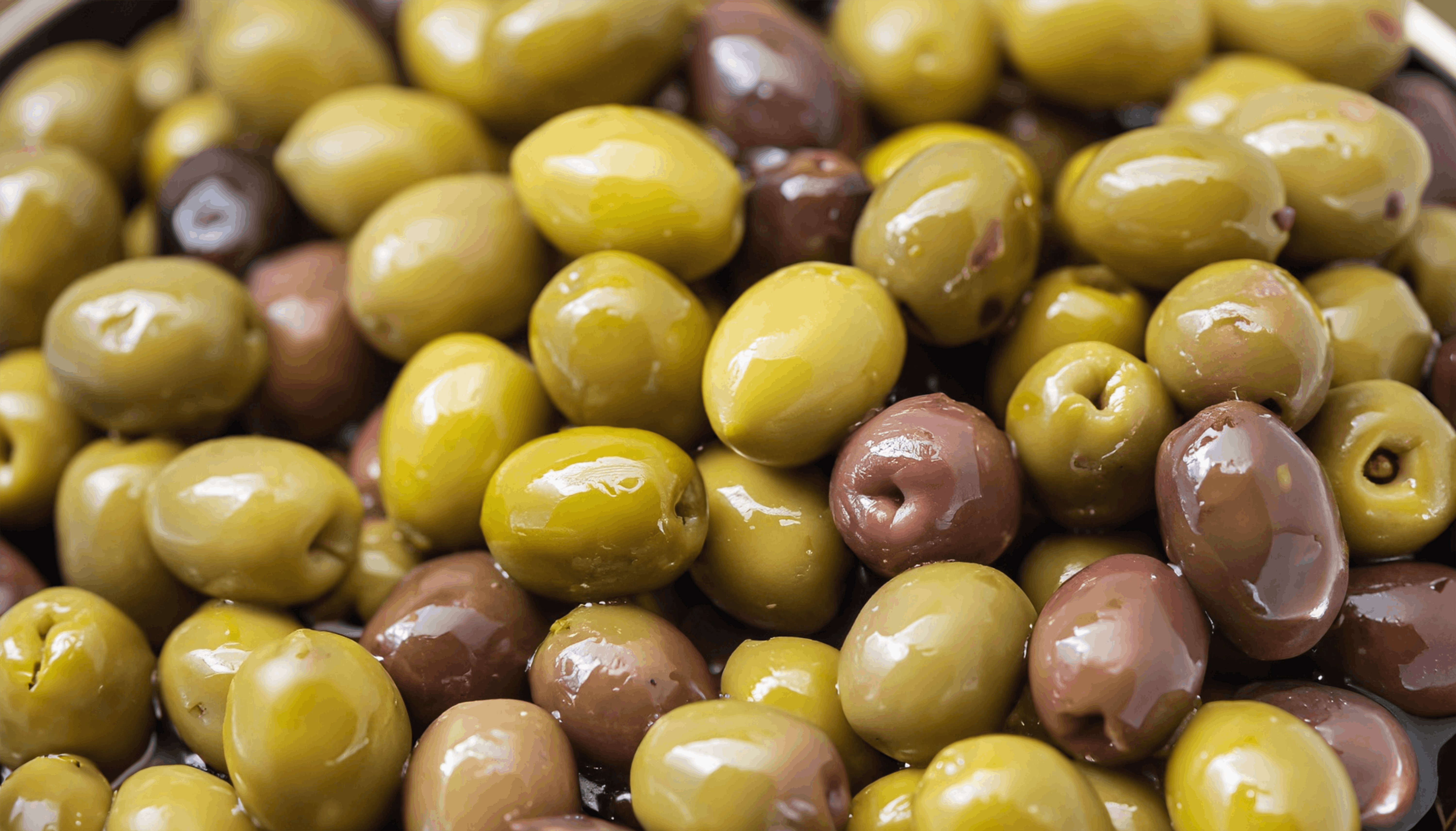 A close-up of fresh green and black olives showcasing rich textures and colors.